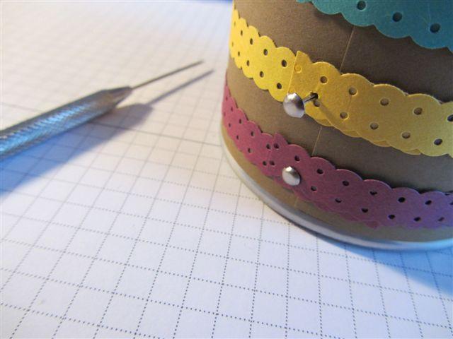 each ribbon strip and through the holes in the mesh of the cup.