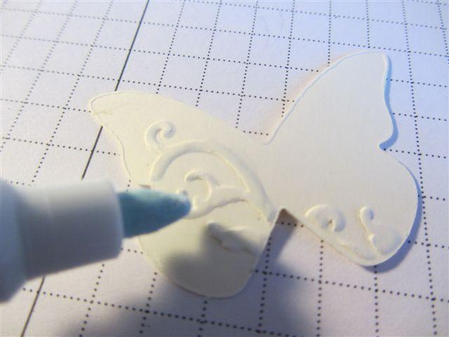 the hole, wiggle the paper piercing tool to enlarge the hole as much as