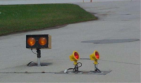 Runway guard light (wig-wags) Manoeuvring Signs Note: Illuminated Display signs are being replaced by back-lit signs and they will look identical during daylight and night.