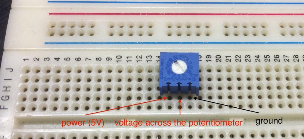 2. Once you have connected the supply voltage, ground and the multimeter,measure the voltage across the potentiometer. 3. Rotate the contact on the potentiometer to adjust the voltage divider.