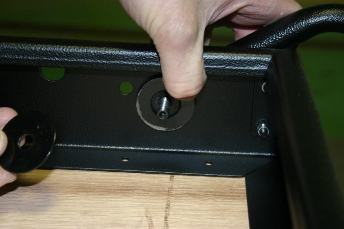 Add one plastic washer to the bolt on the inside of the bed frame.