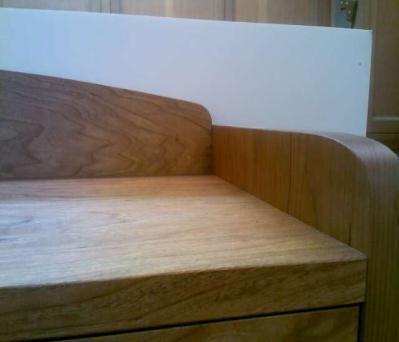 The backsplash and front & back stretchers are attached to the case sides with loose tenons.
