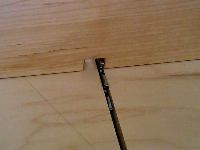 The best way to do this is on the table saw using a cross cut sled, photo #2, with the drawer bottom removed, set the saw blade 5/8 high and make a
