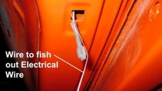 With a steel wire, fish the door switch wire out for the
