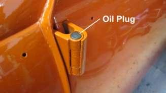 Install the new oil plugs on each door hinge.