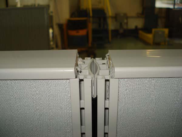 In certain situations on tall panels it may be necessary to tap first hinge down to bottom before tapping down