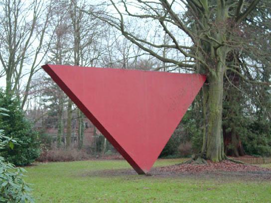 Noel and Sarah were taking part in a mathematics competition with other students from the ProjectMaths schools. They were finding the area of the face of the triangular sculpture shown below.