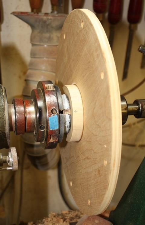 centering it with the tailstock. Use thick CN glue on one surface and accelerant on the other. The edge of this disc should now be sanded smooth.