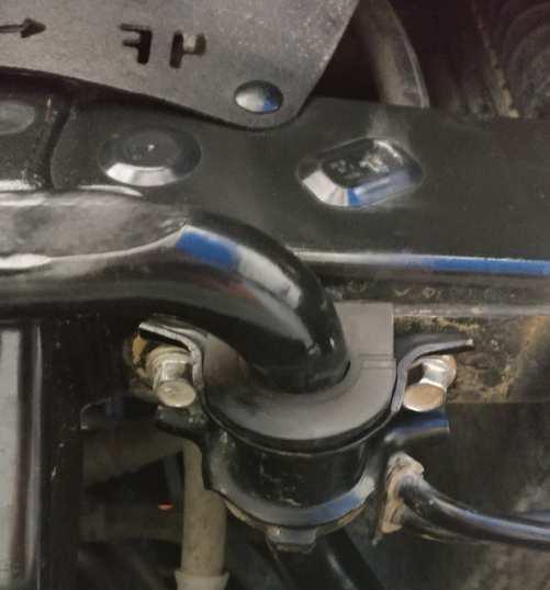 K. Disconnect the sway bar bolts holding sway bar to frame (2 per side) with a 14mm socket and drop the sway bar as