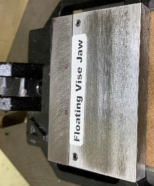Consider a superbly machine shaper vise labeled with a permanent marker. Ouch! Equally bad is a slip of paper glued in place, especially when it gets smeared with grease.