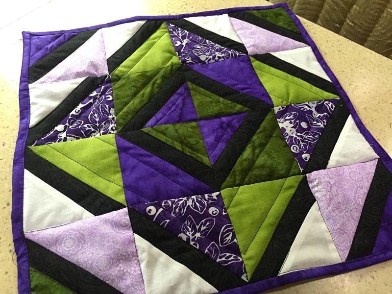 4-7/8" square dark green cut in half diagonally to create a total of 2 triangles 2 ea. 3-7/8" squares dark green cut in half 2 ea. 4-7/8" squares medium purple cut in half 2 ea.