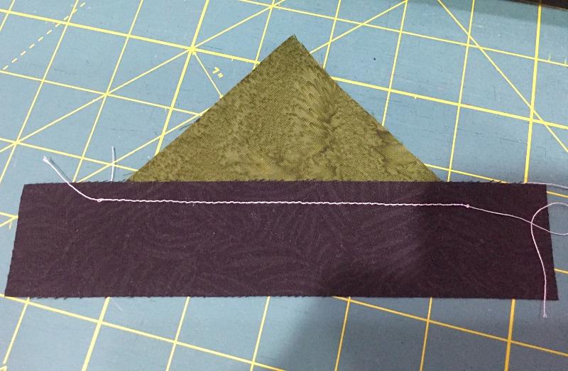 Step 1: You should have a total of 16 smaller triangles, (4 dark purple, 4 dark green, and