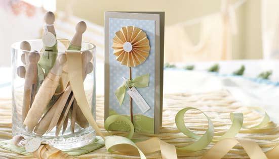 Make your projects threedimensional by using ribbon and fun floral elements such as the accordion-folded flower featured