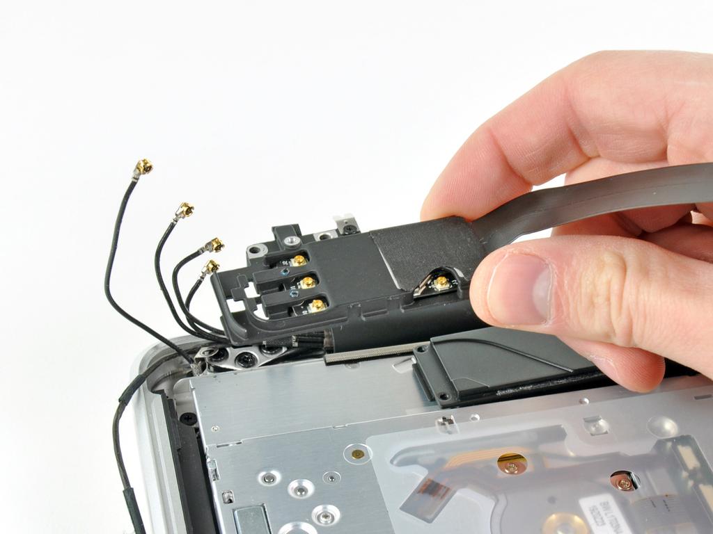 Step 12 Remove the AirPort/Bluetooth assembly, minding the fragile antenna contact near the