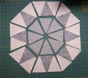 you will need 16 background triangles and 8 each of two different colored triangles. (inner star and star points).