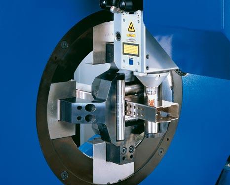 parts buffer. A chute transports small parts up to 300 mm long from the work area.