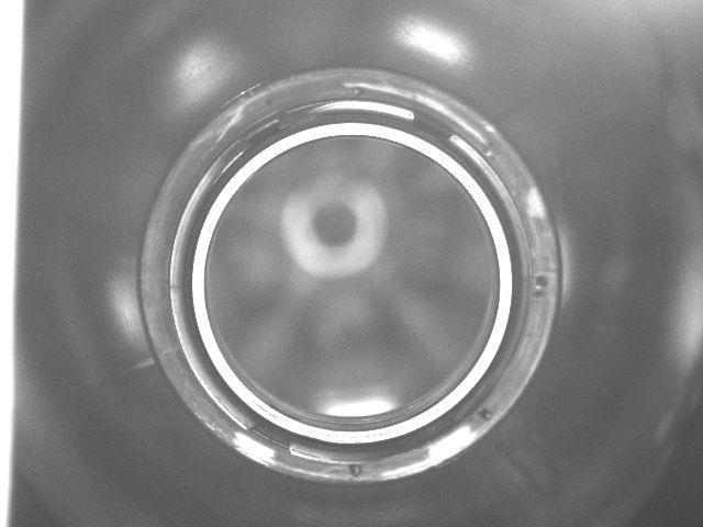 Fig. 21 Blown pop bottle sealing surface under axial diffuse lighting. Left: Clean and unblemished surface (white ring). Right: Damaged surface note the discontinuities in the reflectivity profile.