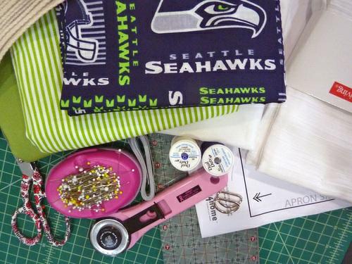 Fabric and Other Supplies 1 yard of 44"+ wide cotton broadcloth or similar in a sports team motif for the body of the apron; we used 58" NFL Cotton Broadcloth in Seattle Seahawks 1 yard of 44"+ wide