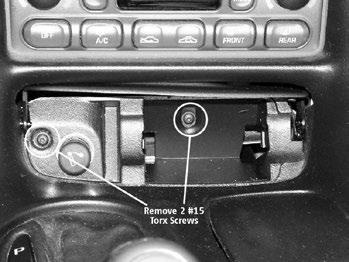 ILLUS. D STEP 6. At this point, there is just one connector left to remove. You will now be able to lift the rear of the console to expose the electrical plug for the fuel door release.