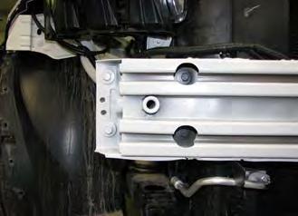 On driver s side only, using an 8MM socket, remove the two bolts from the bracket holding the speed control underneath the bumper.