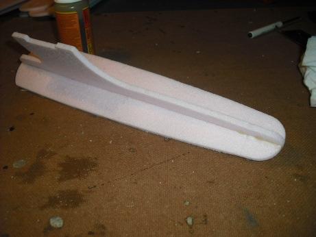 Put a thin layer of glue the full length of the nacelle in line with the slot on both sides of both pieces. 23.