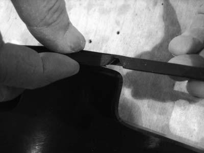Applying the adhesive side of the edge trim to the inner side of the fl are, affi x the edge trim to the top edge of the fl are (the portion
