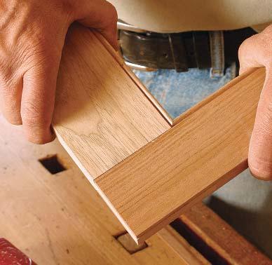Use a tenoning jig to cut a slot in the end of each stile of the face frame. The rails of the frame are tenoned to fit the slots in the stiles, completing the bridle joint. Mitered bead.
