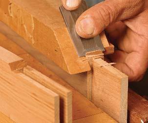 Cut close to the line on the bandsaw and use a spokeshave to plane it to a smooth and fair curve.