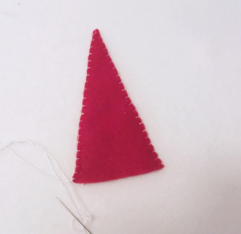 Blanket stitch the sides of the red gnome hat with the white embroidery