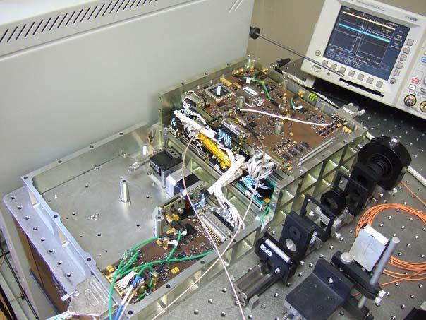 Figure 2. T2L2 engineering model: the electronic Unit, opened, during tests at the OCA. Figure 3. Precision and propagation delay of the nonlinear detection.