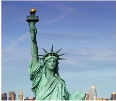 Using the picture of the Statue of Liberty and the fact that her nose measure 4 feet 6 inches from the bridge to the tip, determine the length of the Statue of Liberty's right arm, the one holding