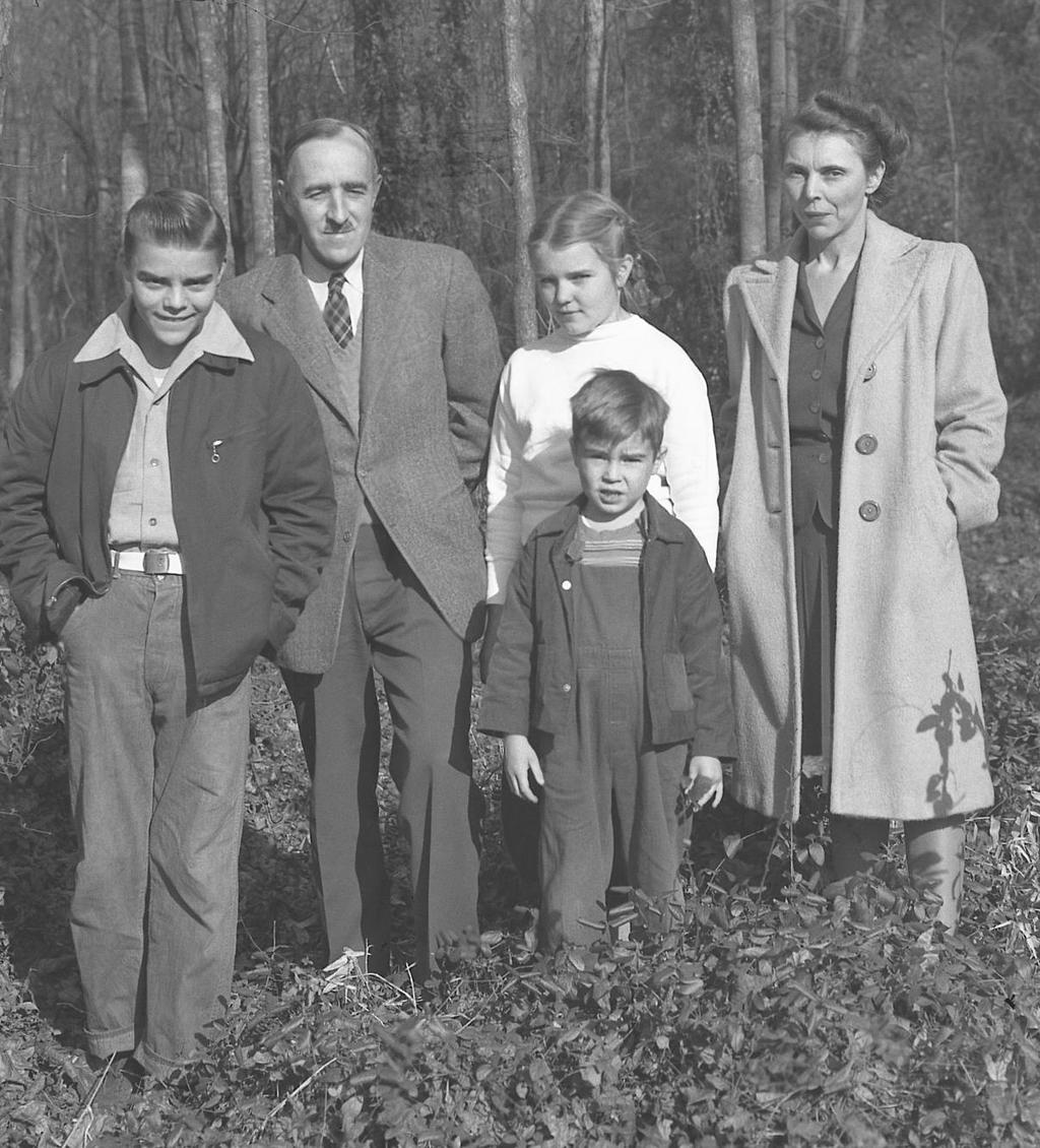 In this family photo taken about 1947 in the backyard of the Wollan house at 107 Oneida Lane are