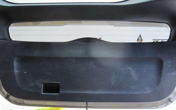 Open the hatch and remove the back door lower trim board panel. It is held on by 11 blue plastic clips. Use your trim removal tool to lift one corner and pull until first clip detaches.