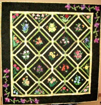 The 2013 Opportunity Quilt FLOWERS IN THE NIGHT is 80"x80". It is machine pieced, hand appliquéd, has embroidery and paint embellishment, broderie perse stitching, and is hand quilted.