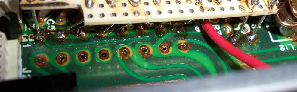 An insulator is placed between the bottom of the board and the top of the existing circuitry below it. The other wires connecting to the PCB are 22AWG solid wire.