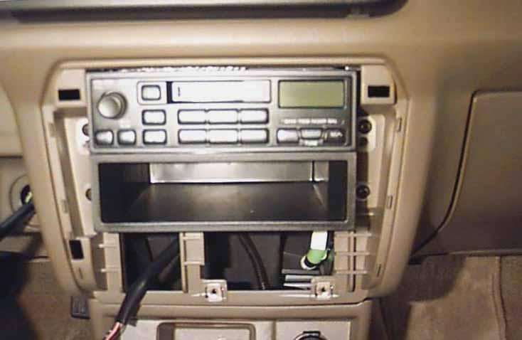 STEP 3: Once the plastic dash panel has been completely unsnapped from the dash, you will notice the radio and pocket below the radio.