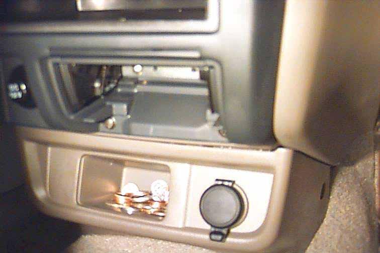 Unplug 2 white connectors snapped into the rear of the radio. The radio can now be completely removed from the dash.