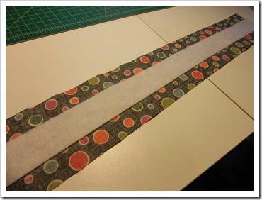 For the handles, from the strap fabric, cut four strips 3 1/2 by 21 and cut four