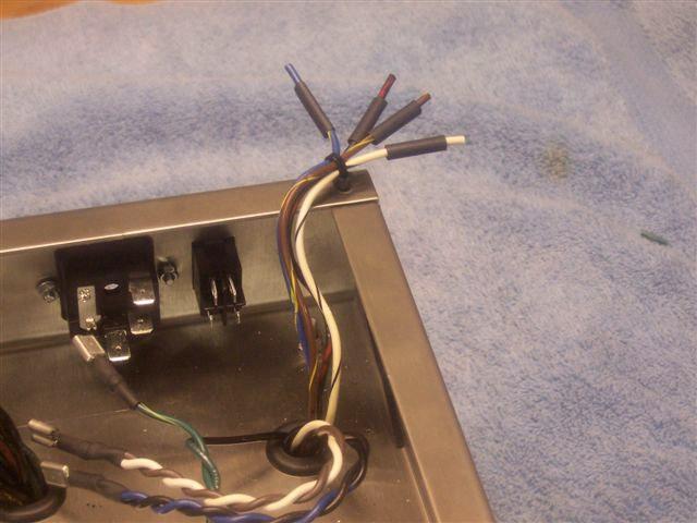6) Take the LIVE wire from the Mains Primary ( the primaries are the set of wires closest to the edge of the chassis) and trim to about 15cm in length - Strip off the end and then tin ( apply solder)