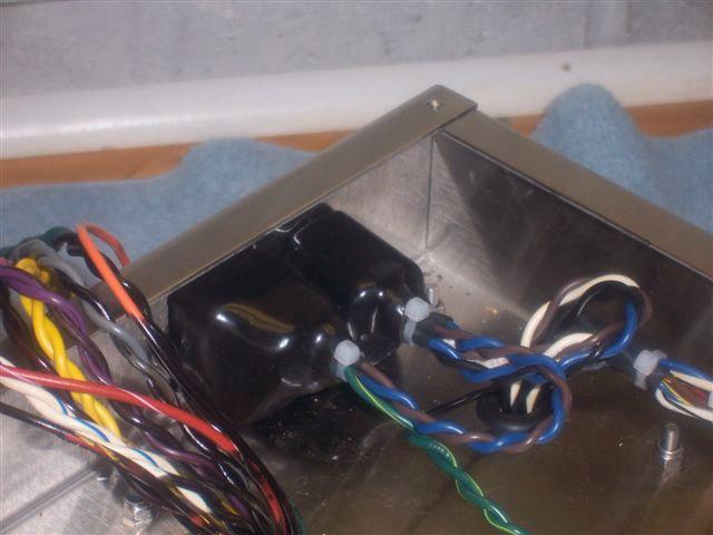 Trim those wires not used to about 5 centimetres length, slide a 2 centimetre length of heat shrink tubing over each of the