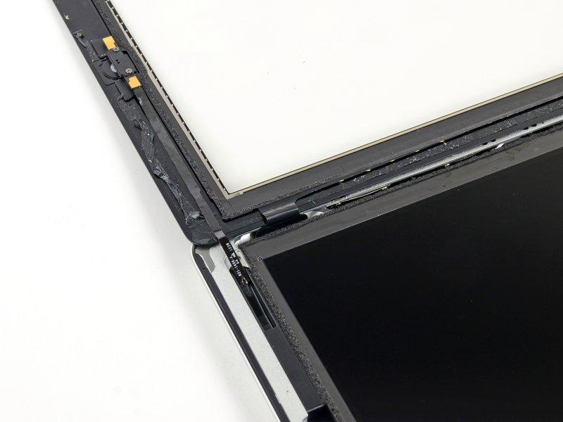 Rotate the LCD along its left edge and lay it down on top