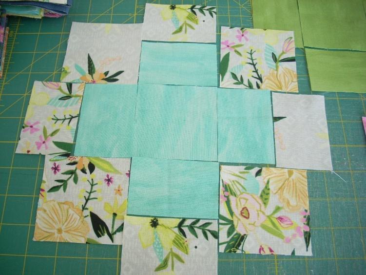 Each block consists of a 3 inch square for the center and four 2 x 3 inch rectangles of solid fabric and four 3 inch squares and four 1.