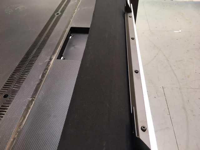 over the VESA mounting holes. Note that the back of the TV pictured below is not flat.