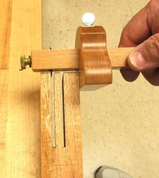 Lay a straightedge on the major axis of the ellipse to establish the shoulders of the tenon, and mark them with a knife.