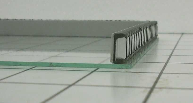 Lay the Pointspacer about 1/16" in and parallel to the glass edge, or at the inset set by the Flexible Spacer PRO tool.