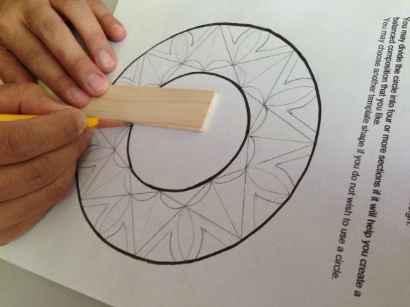 Lesson 2 Use a straight edge ort ruler to divide the frame area into sections and draw a radial design with pencil.